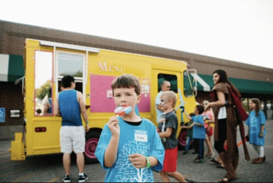 Youth eating ice cream wearing custom t-shirt