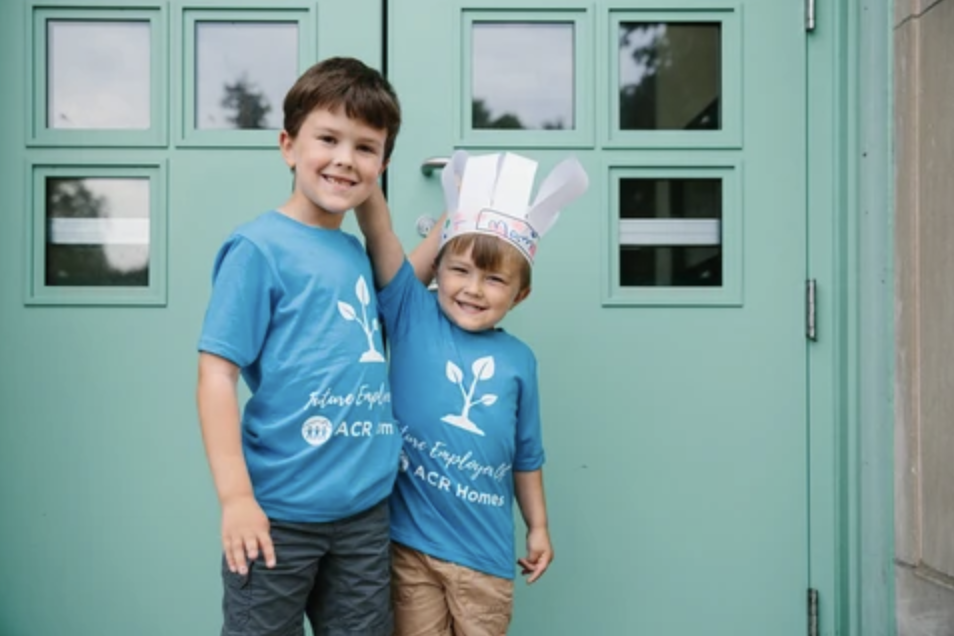 Two kids wearing custom ACR Homes shirts by Foxtrot Custom